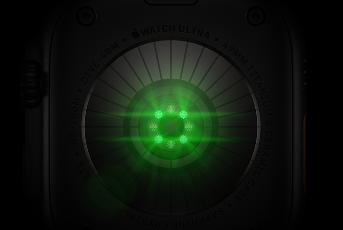 Parte posterior de un Apple Watch Ultra 4, caja de titanio, color negro, varios sensores redondos con luces LED verdes brillantes