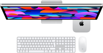 Mac mini colocada debajo de un monitor Studio Display, Magic Keyboard con teclado numérico, Magic Mouse